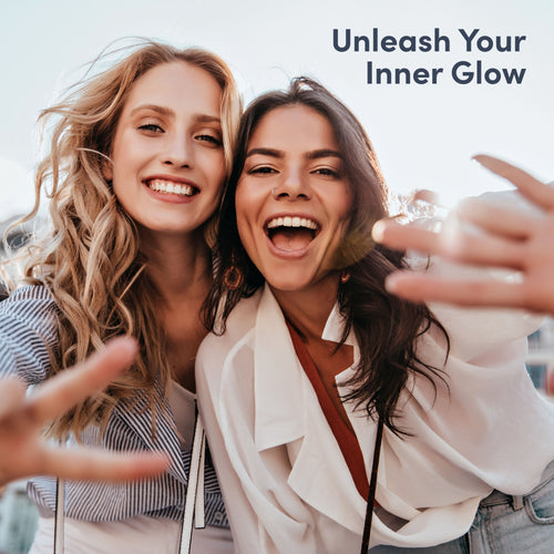 Two women taking a selfie with text 'Unleash Your Inner Glow' above them.