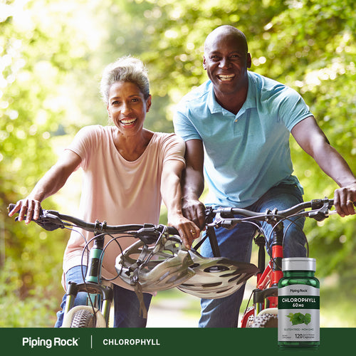 Couple riding bicycles outdoors with a Piping Rock Chlorophyll supplement bottle.