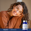 Woman smiling with a bottle of Piping Rock L-Methylfolate supplement in the corner.