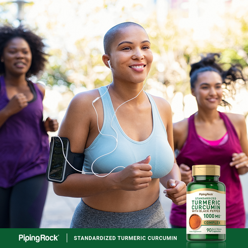 Woman running outdoors with a bottle of Piping Rock Turmeric Curcumin supplement in the foreground.