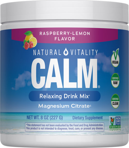 Container of Natural Vitality Calm Relaxing Drink Mix with raspberry-lemon flavor on a beach background