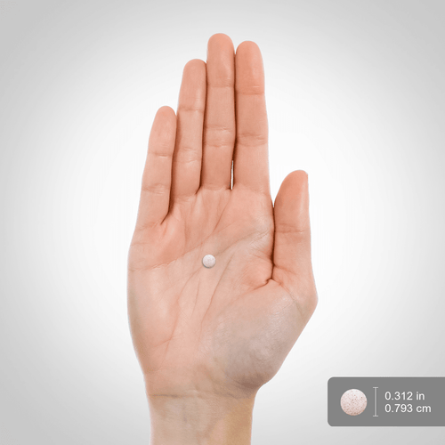 Hand holding a small white object with measurement indicators on a light gray background