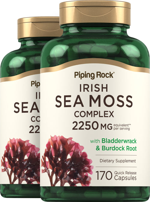 Two bottles of Piping Rock Irish Sea Moss Complex dietary supplement with gold caps and green labels.