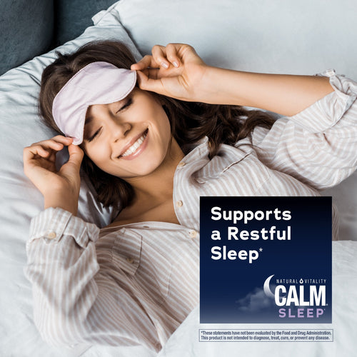 Woman wearing a sleep mask with 'Calm Sleep' product label